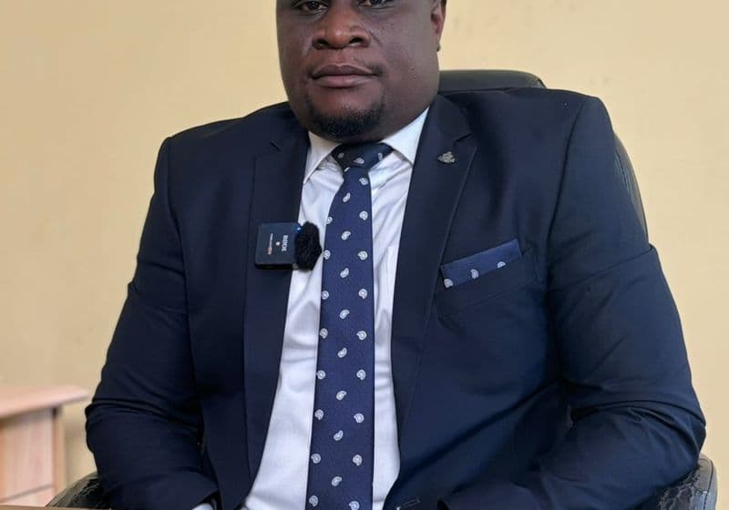 School Director of Bidii Schools — portrait in a navy suit