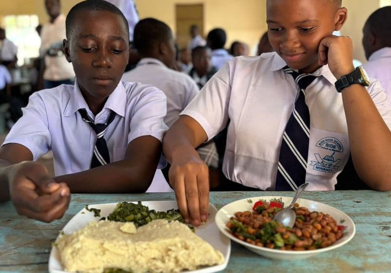 Students enjoying ugali and beans in the Bidii Schools dining hall