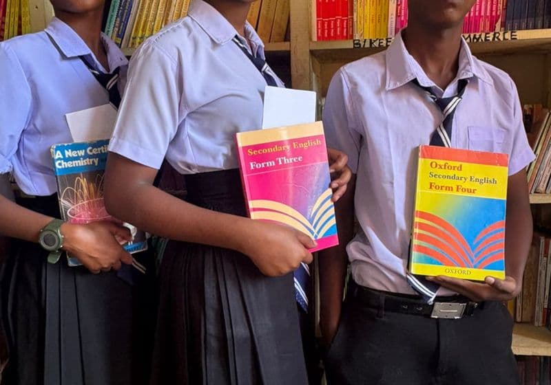 Students reading quietly among the shelves in the Bidii Schools library