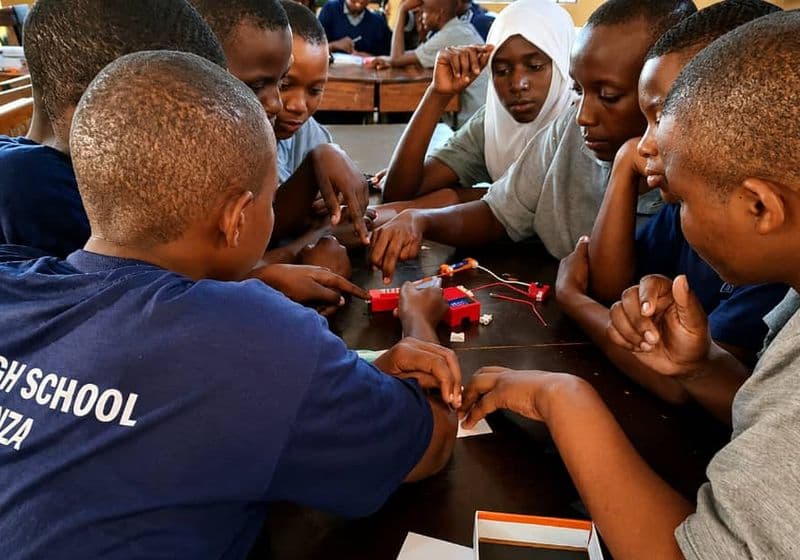 Students assembling electronic circuit kits during a STEM practical session at Bidii Schools
