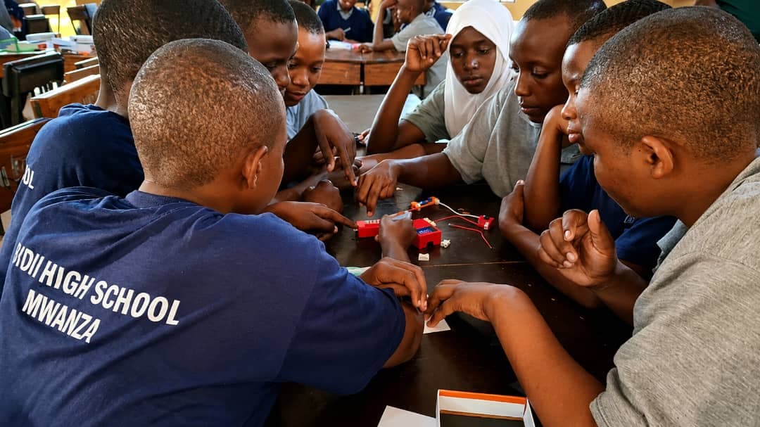 Students assembling electronic circuit kits during a STEM practical session at Bidii Schools