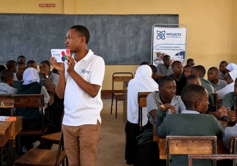 A teacher presenting a science kit to the class at Bidii Schools