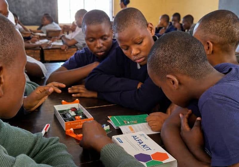 Students experimenting with a STEM learning kit in the Bidii Schools science class